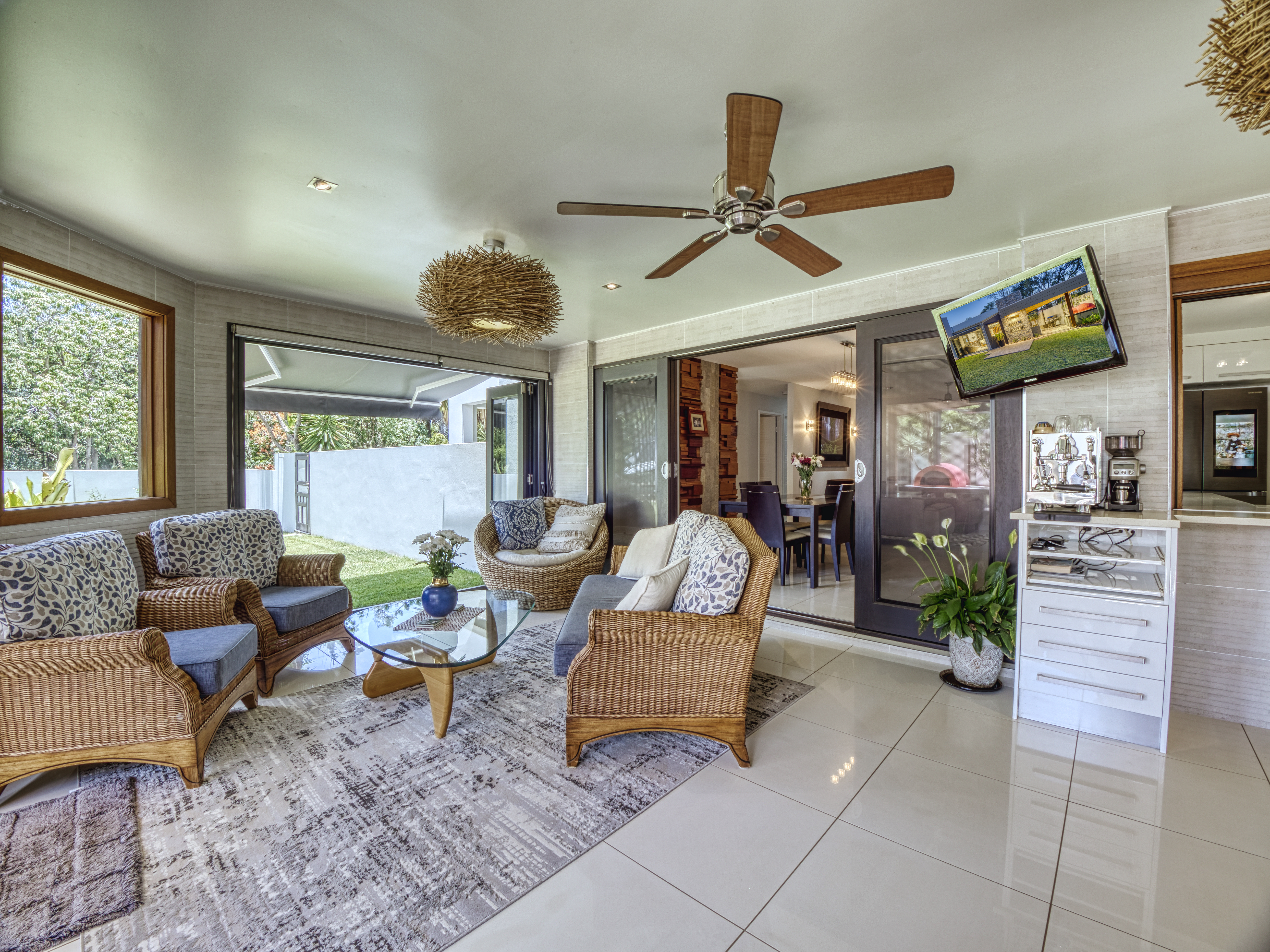 Indoor/outdoor room photography show enhanced livability of a home showcasing the entertainment value of a home